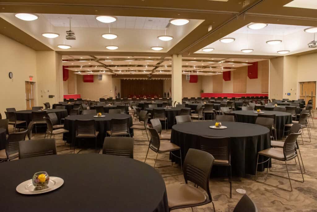Grand Auditorium 6 GTCC Conference Center Grand Auditorium view of round tables with black table cloths.